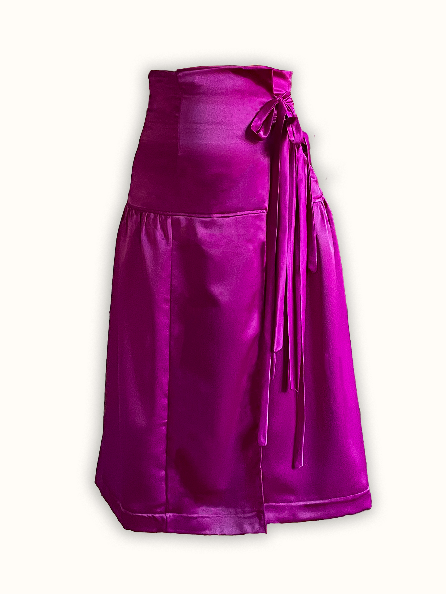 A high-waisted wrap skirt made from deadstock fabric, featuring a satin texture, a tiered design, and decorative ribbon laces tied at the side. A colorful, slow fashion, made-to-order piece
